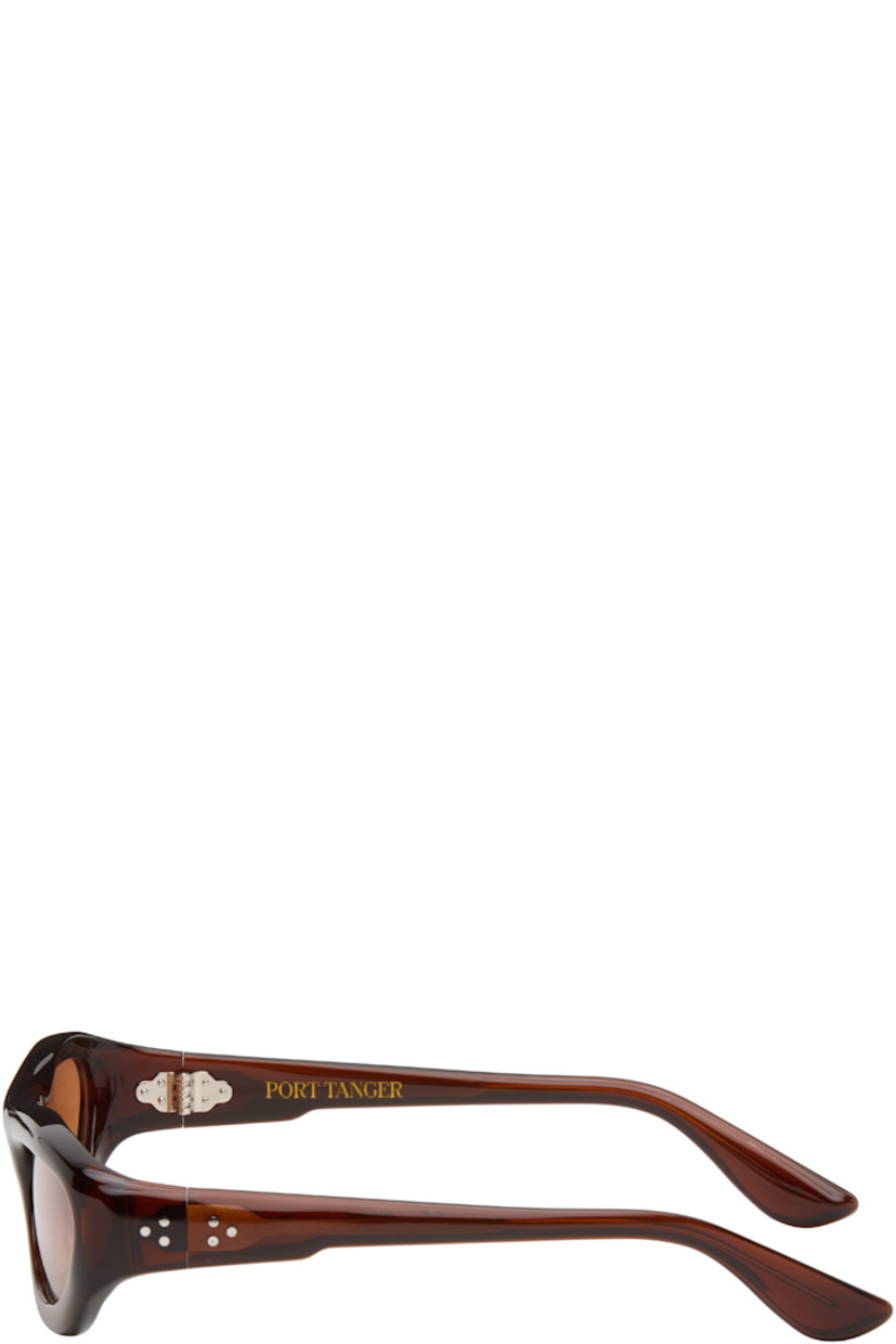Handcrafted oval cellulose acetate-frame sunglasses.

· Brown lenses
· 100% UVA/UVB protection
· Integrated nose pads
· Signature rivets at temples
· Exposed core wires
· Includes pouch
· Size: 59.20 137

Part of the Bast collection.

Supplier color: Bunaa/Amber