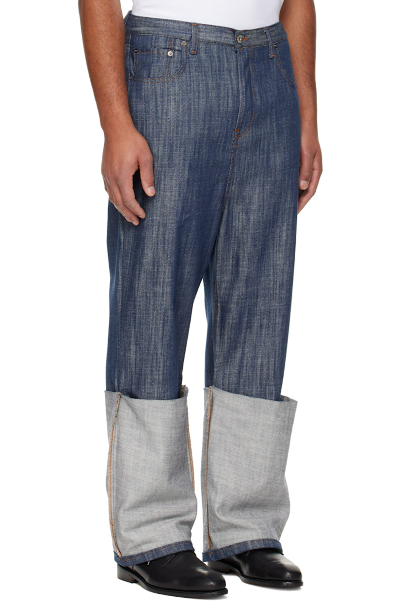 Lightweight non-stretch denim jeans.

· Belt loops
· Five-pocket styling
· Button fly
· Rolled cuffs
· Dropped inseam
· Logo patch at back waistband
· Contrast stitching in tan

Supplier color: Indigo