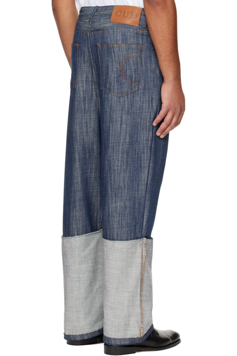 Lightweight non-stretch denim jeans.

· Belt loops
· Five-pocket styling
· Button fly
· Rolled cuffs
· Dropped inseam
· Logo patch at back waistband
· Contrast stitching in tan

Supplier color: Indigo