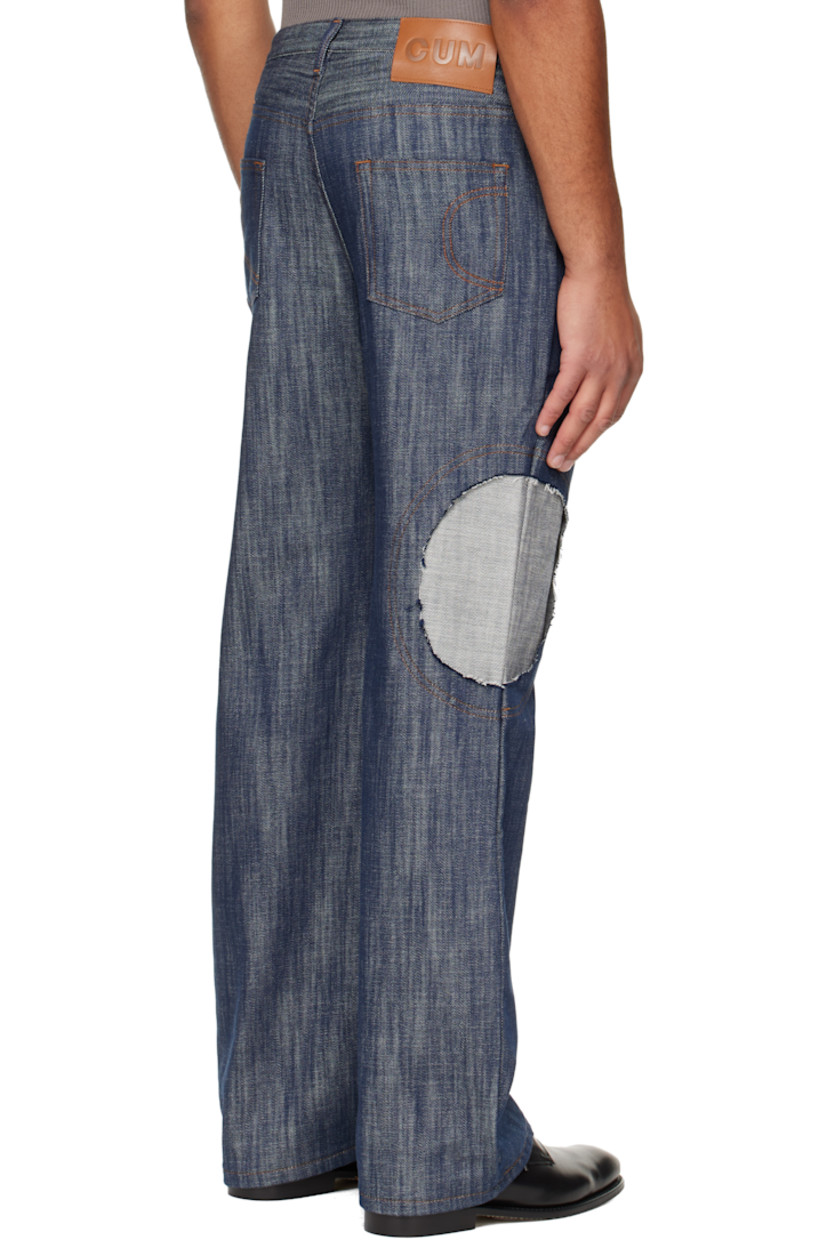 Lightweight non-stretch denim jeans. 

· Straight-leg
· Belt loops
· Five-pocket styling
· Button-fly
· Inset panel with raw edge at leg
· Logo patch at back waistband
· Contrast stitching in tan

Supplier color: Indigo