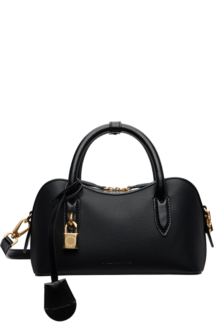 Grained faux-leather top handle bag.

· Press-stud tab at rolled carry handles
· Detachable logo-embossed sheathed key at handle
· Adjustable and detachable crossbody strap
· Padlock and embossed logo at face
· Bumper studs at base
· Two-way zip closure
· Patch pocket at interior
· GOTS-certified organic hemp-blend canvas lining
· Logo-engraved antiqued gold-tone hardware
· H5" x W9.25" x D3.5"

Made from cruelty-free, non-animal materials.

Supplier color: Black