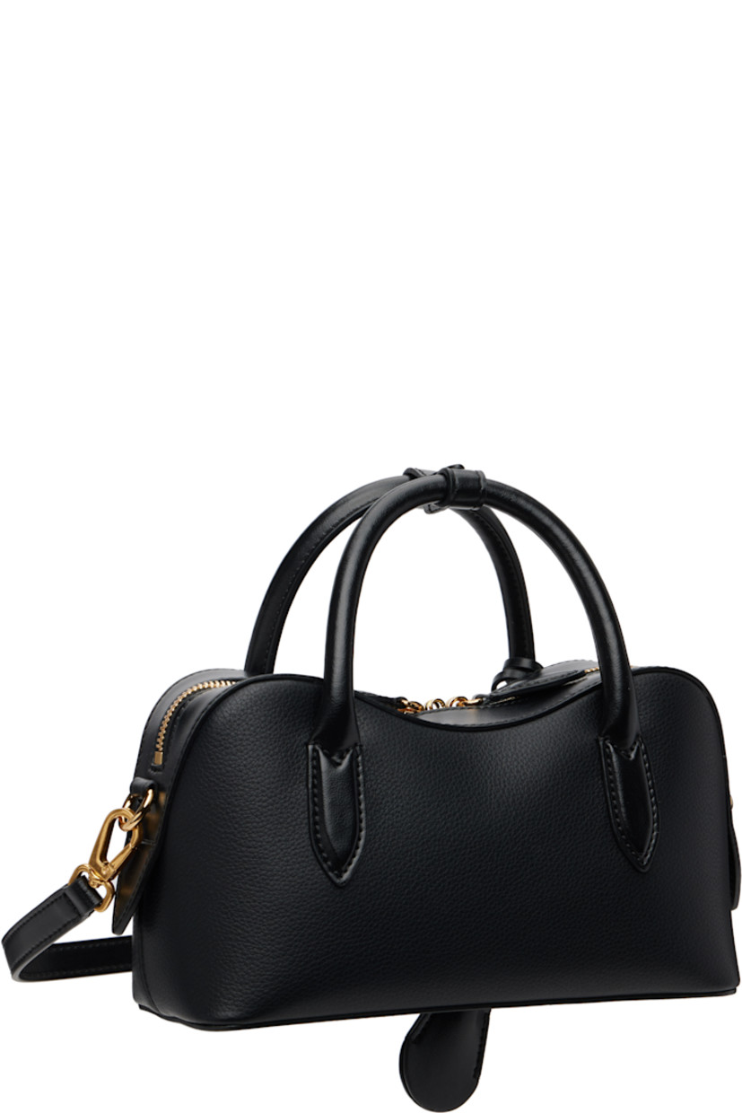 Grained faux-leather top handle bag.

· Press-stud tab at rolled carry handles
· Detachable logo-embossed sheathed key at handle
· Adjustable and detachable crossbody strap
· Padlock and embossed logo at face
· Bumper studs at base
· Two-way zip closure
· Patch pocket at interior
· GOTS-certified organic hemp-blend canvas lining
· Logo-engraved antiqued gold-tone hardware
· H5" x W9.25" x D3.5"

Made from cruelty-free, non-animal materials.

Supplier color: Black