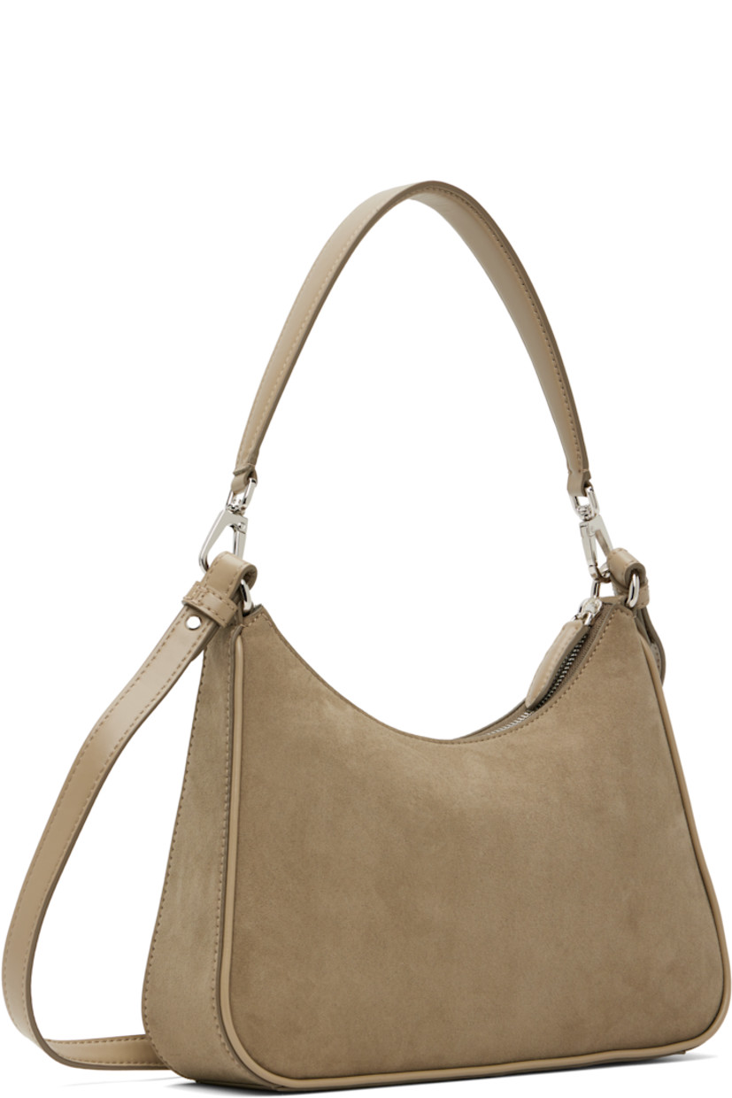 Faux-suede shoulder bag.

· Buffed faux-leather trim throughout
· Detachable carry handle
· Adjustable and detachable shoulder strap
· Perforated logo at face
· Zip closure
· Zip pocket at interior
· Buffed faux-leather lining
· H9.5" x W7" x D2.5"

Made from cruelty-free, non-animal materials.

Supplier color: Khaki