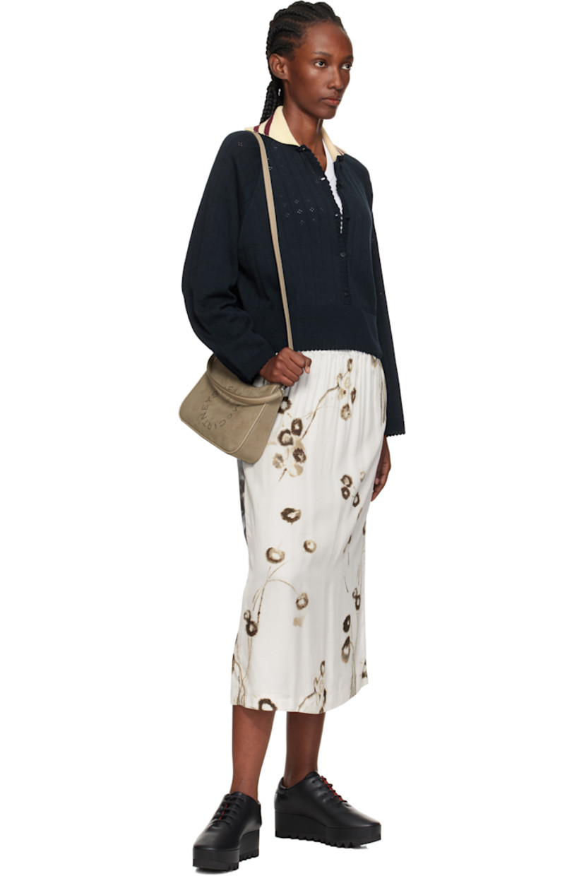 Faux-suede shoulder bag.

· Buffed faux-leather trim throughout
· Detachable carry handle
· Adjustable and detachable shoulder strap
�· Perforated logo at face
· Zip closure
· Zip pocket at interior
· Buffed faux-leather lining
· H9.5" x W7" x D2.5"

Made from cruelty-free, non-animal materials.

Supplier color: Khaki