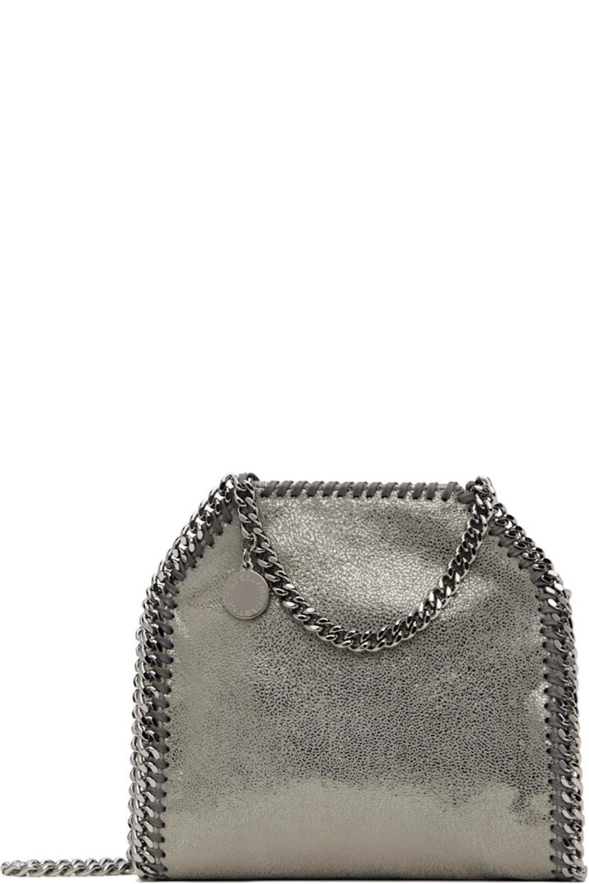Grained faux-leather shoulder bag in silver tone.

· GOTS-certified organic cotton whipstitching
· Curb chain trim throughout
· Fixed carry handles
· Logo charm at handle
· Fixed crossbody strap
· Magnetic press-stud closure
· Patch pocket at interior
· Logo-woven twill lining
· H7.5" x W6.5" x D3"

Made from cruelty-free, non-animal materials.

Supplier color: Grey