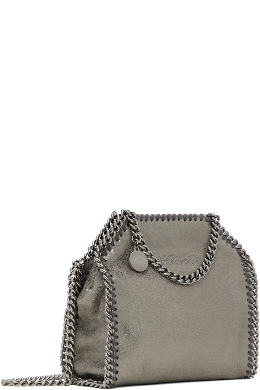 Grained faux-leather shoulder bag in silver tone.

· GOTS-certified organic cotton whipstitching
· Curb chain trim throughout
· Fixed carry handles
· Logo charm at handle
· Fixed crossbody strap
· Magnetic press-stud closure
· Patch pocket at interior
· Logo-woven twill lining
· H7.5" x W6.5" x D3"

Made from cruelty-free, non-animal materials.

Supplier color: Grey