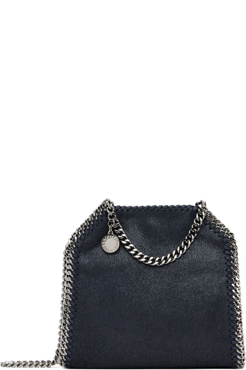 Grained faux-leather shoulder bag in navy. 

· GOTS-certified organic cotton whipstitching
· Curb chain trim throughout
· Fixed carry handles
· Logo charm at handle
· Fixed crossbody strap
· Magnetic press-stud closure
· Patch pocket at interior
· Logo-woven twill lining
· H7.5" x W6.5" x D3"

Made from cruelty-free, non-animal materials.

Supplier color: Midnight