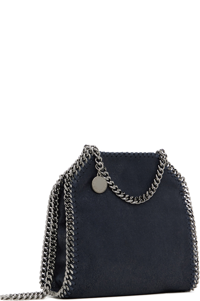 Grained faux-leather shoulder bag in navy. 

· GOTS-certified organic cotton whipstitching
· Curb chain trim throughout
· Fixed carry handles
· Logo charm at handle
· Fixed crossbody strap
· Magnetic press-stud closure
· Patch pocket at interior
· Logo-woven twill lining
· H7.5" x W6.5" x D3"

Made from cruelty-free, non-animal materials.

Supplier color: Midnight
