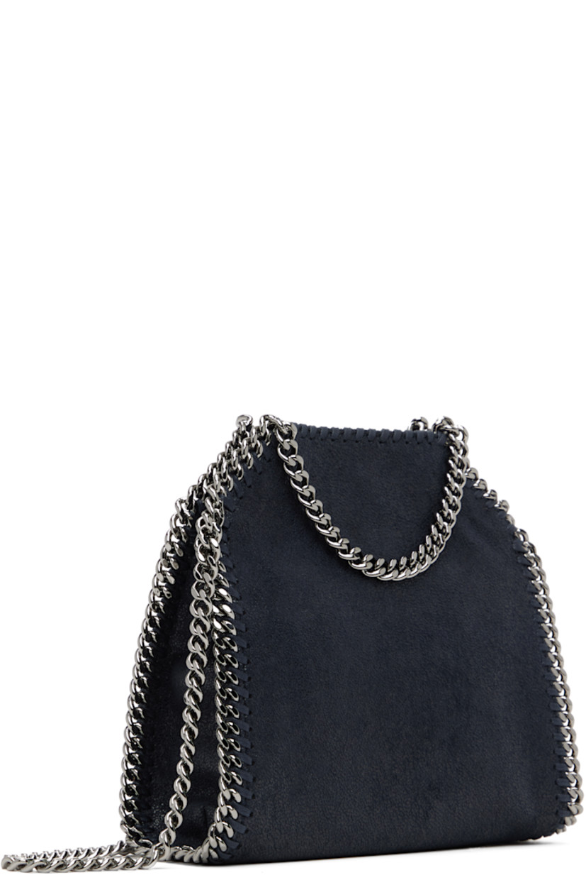 Grained faux-leather shoulder bag in navy. 

· GOTS-certified organic cotton whipstitching
· Curb chain trim throughout
· Fixed carry handles
· Logo charm at handle
· Fixed crossbody strap
· Magnetic press-stud closure
· Patch pocket at interior
· Logo-woven twill lining
· H7.5" x W6.5" x D3"

Made from cruelty-free, non-animal materials.

Supplier color: Midnight