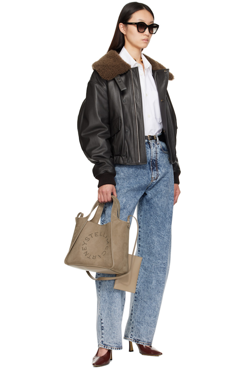 Faux-suede tote. 

· Piping throughout
· Integrated carry handles
· Adjustable and detachable crossbody strap
· Perforated logo at face
· Magnetic press-stud closure
· Detachable pouch-on-lanyard at interior
· Buffed faux-leather interior
· H10" x W12" x D5"

Made from cruelty-free, non-animal materials.

Supplier color: Khaki