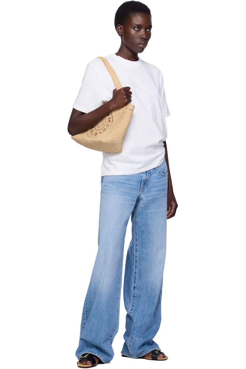 Handcrafted woven raffia tote in beige.

· Fixed shoulder straps
· Hand-embroidered logo at face
· Magnetic press-stud closure
· Patch pocket at interior
· H9" x W15.5" x D5"

Made from cruelty-free, non-animal materials.

Supplier color: Natural