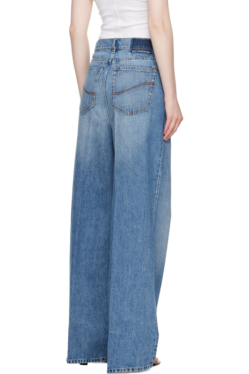 Non-stretch GOTS-certified organic cotton denim jeans. Fading and whiskering throughout.

· Wide-leg
· High-rise
· Belt loops
· Five-pocket styling
· Zip fly
· Creased legs
· Logo embroidered at back waistband
· Topstitching at back pockets
· Logo-engraved silver-tone hardware
· Contrast stitching in tan

Made from cruelty-free, non-animal materials.

Supplier color: Mid vintage blue