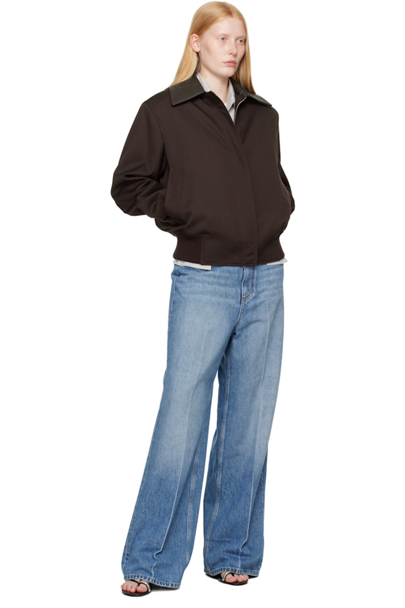 Non-stretch GOTS-certified organic cotton denim jeans. Fading and whiskering throughout.

· Wide-leg
· High-rise
· Belt loops
· Five-pocket styling
· Zip fly
· Creased legs
· Logo embroidered at back waistband
· Topstitching at back pockets
· Logo-engraved silver-tone hardware
· Contrast stitching in tan

Made from cruelty-free, non-animal materials.

Supplier color: Mid vintage blue