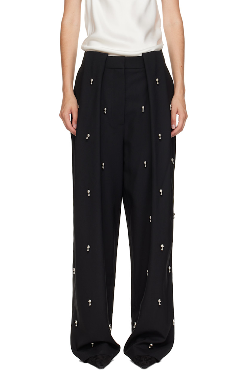 Wool twill trousers.

· Graphic hardware throughout 
· Belt loops
· Three-pocket styling
· Zip fly 
· Box pleats at front waist
· Unlined
· Silver-tone hardware

Made from cruelty-free materials.

Supplier color: Black