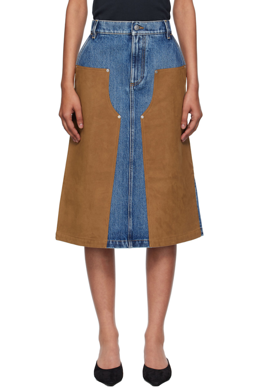 Non-stretch denim and faux-suede midi skirt.

· Fading throughout
· Paneled construction
· Belt loops
· Two-pocket styling
· Zip fly
· Logo patch at back waistband
· Contrast stitching in tan

Made from cruelty-free, non-animal materials.

Supplier color: Mid vintage