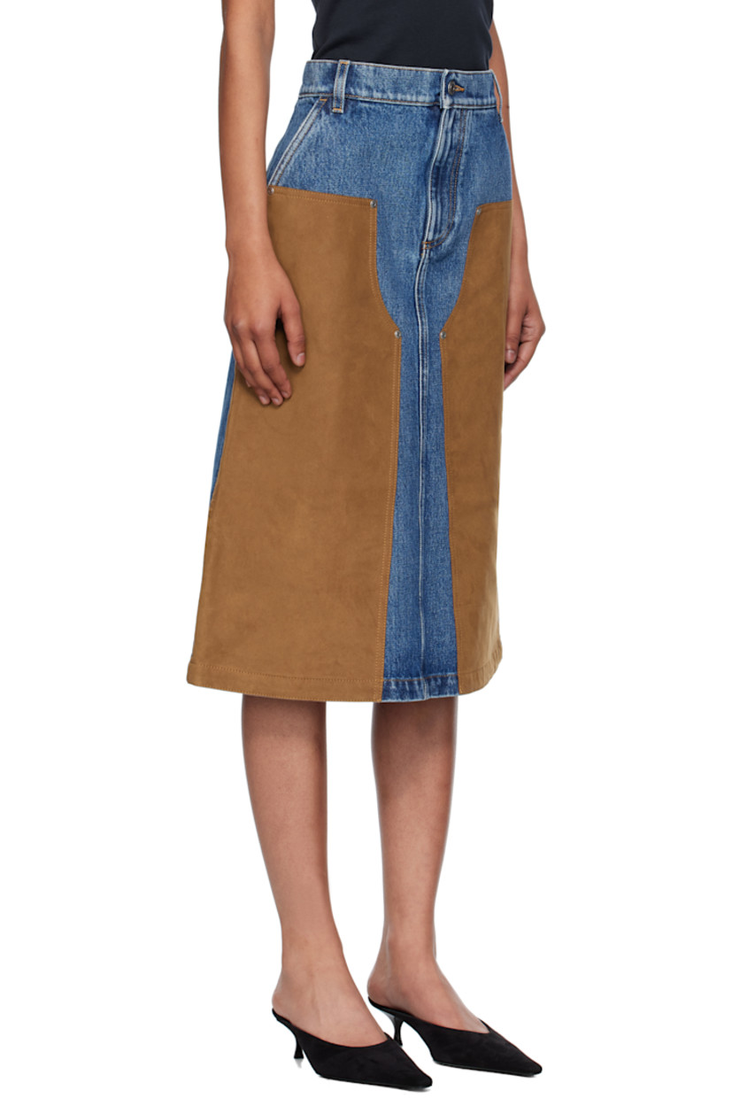 Non-stretch denim and faux-suede midi skirt.

· Fading throughout
· Paneled construction
· Belt loops
· Two-pocket styling
· Zip fly
· Logo patch at back waistband
· Contrast stitching in tan

Made from cruelty-free, non-animal materials.

Supplier color: Mid vintage