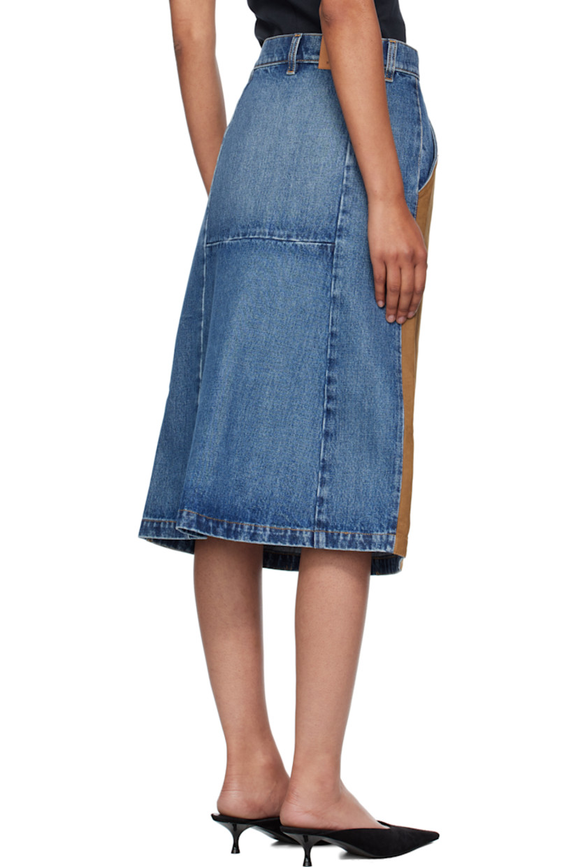 Non-stretch denim and faux-suede midi skirt.

· Fading throughout
· Paneled construction
· Belt loops
· Two-pocket styling
· Zip fly
· Logo patch at back waistband
· Contrast stitching in tan

Made from cruelty-free, non-animal materials.

Supplier color: Mid vintage