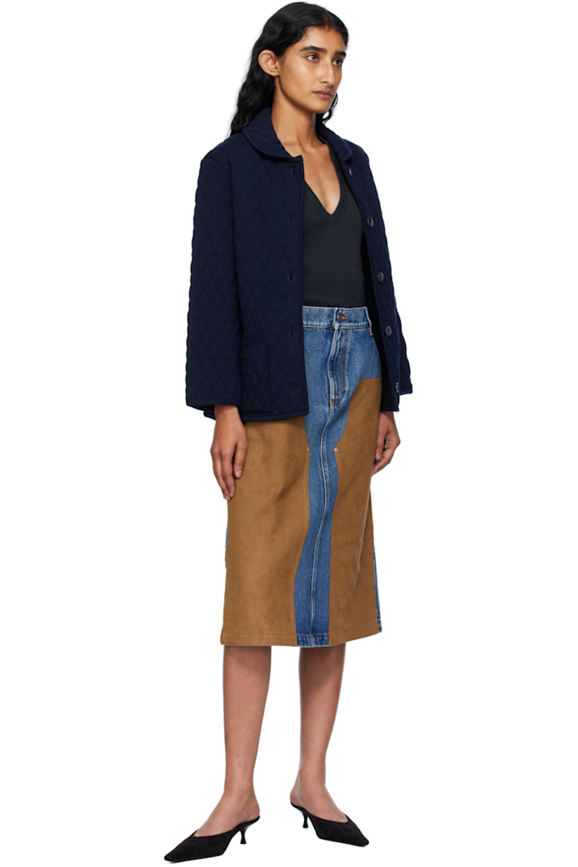 Non-stretch denim and faux-suede midi skirt.

· Fading throughout
· Paneled construction
· Belt loops
· Two-pocket styling
· Zip fly
· Logo patch at back waistband
· Contrast stitching in tan

Made from cruelty-free, non-animal materials.

Supplier color: Mid vintage
