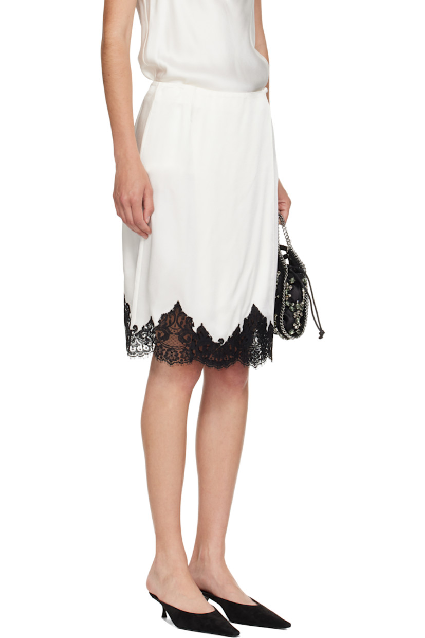 Charmeuse midi skirt. 

· Wrap construction 
· Button fastening at waistband
· Guipure lace trim with scalloped edge at hem 

Made from cruelty-free, non-animal materials.

Supplier color: Cream