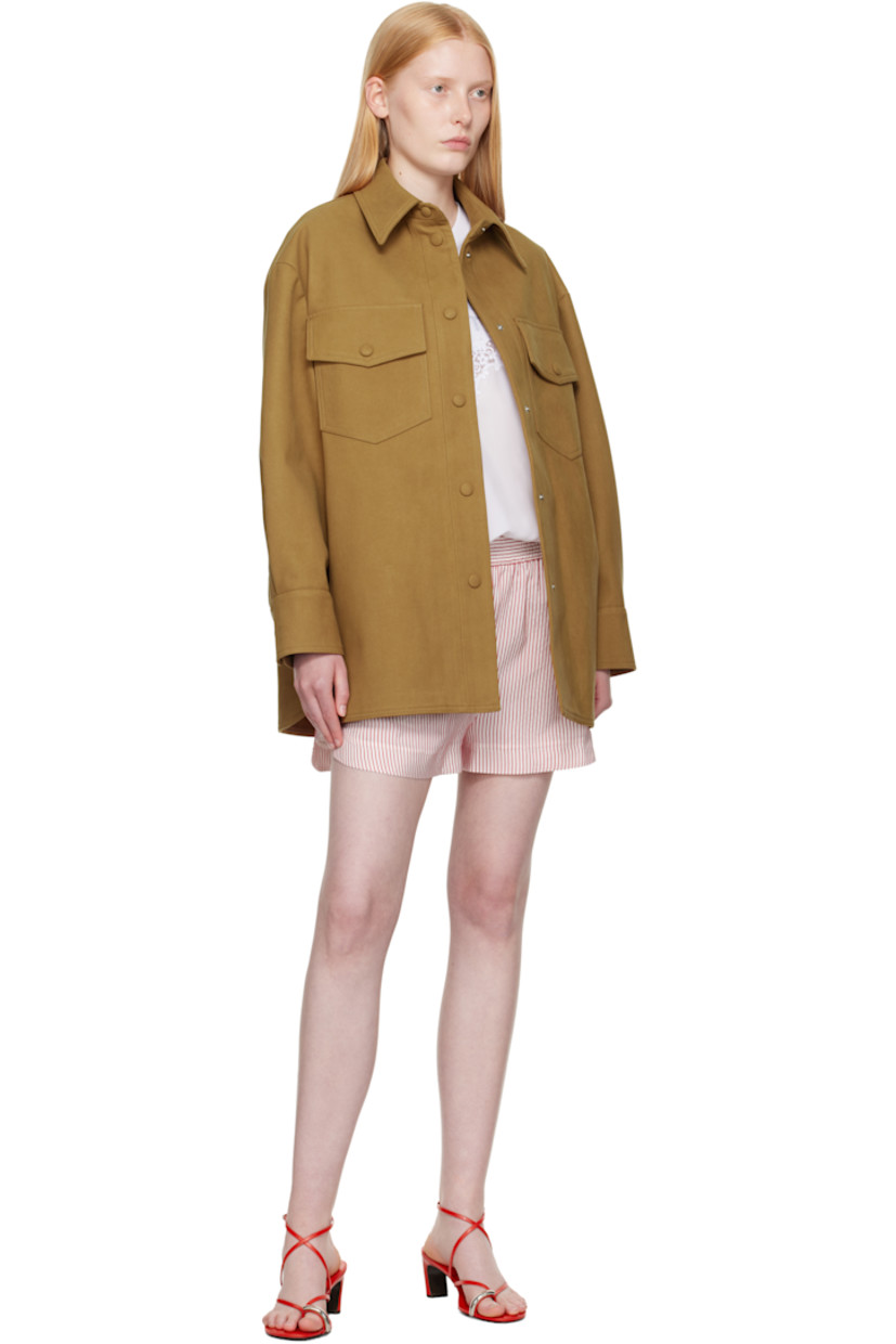 Faux-suede overshirt.

· Spread collar
· Press-stud closure
· Flap pockets at chest
· Seam pockets
· Shirttail hem
· Vented side seams 
· Pleats at press-stud barrel cuffs

Made from cruelty-free, non-animal materials.

Supplier color: Wallnut