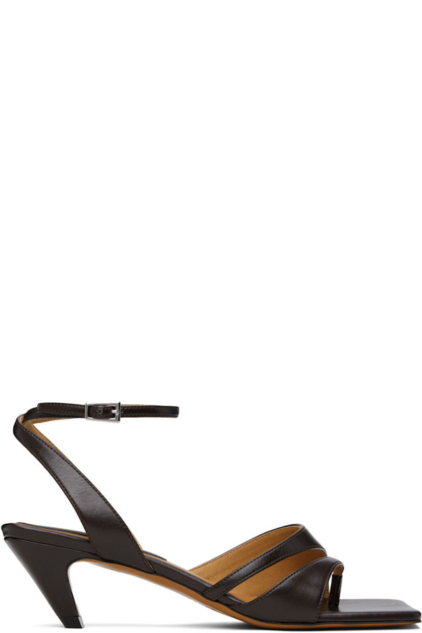 Buffed faux-leather heeled sandals in brown.

· Open square toe
· Thong-style strap at vamp
· Pin-buckle ankle strap
· Logo patch at padded footbed
· Covered kitten heel with rubber injection
· Faux-leather sole
· Heel: H2"

Made from cruelty-free, non-animal materials.

Supplier color: Chocolate brown
