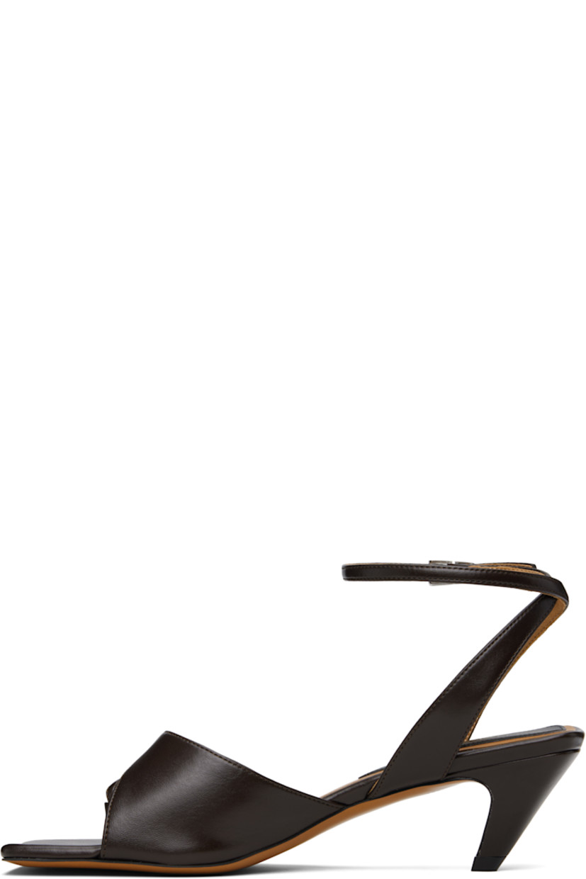 Buffed faux-leather heeled sandals in brown.

· Open square toe
· Thong-style strap at vamp
· Pin-buckle ankle strap
· Logo patch at padded footbed
· Covered kitten heel with rubber injection
· Faux-leather sole
· Heel: H2"

Made from cruelty-free, non-animal materials.

Supplier color: Chocolate brown