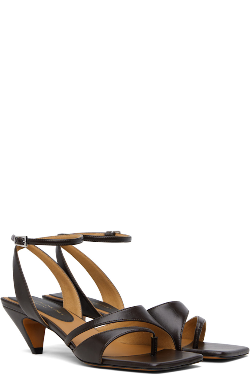 Buffed faux-leather heeled sandals in brown.

· Open square toe
· Thong-style strap at vamp
· Pin-buckle ankle strap
· Logo patch at padded footbed
· Covered kitten heel with rubber injection
· Faux-leather sole
�· Heel: H2"

Made from cruelty-free, non-animal materials.

Supplier color: Chocolate brown