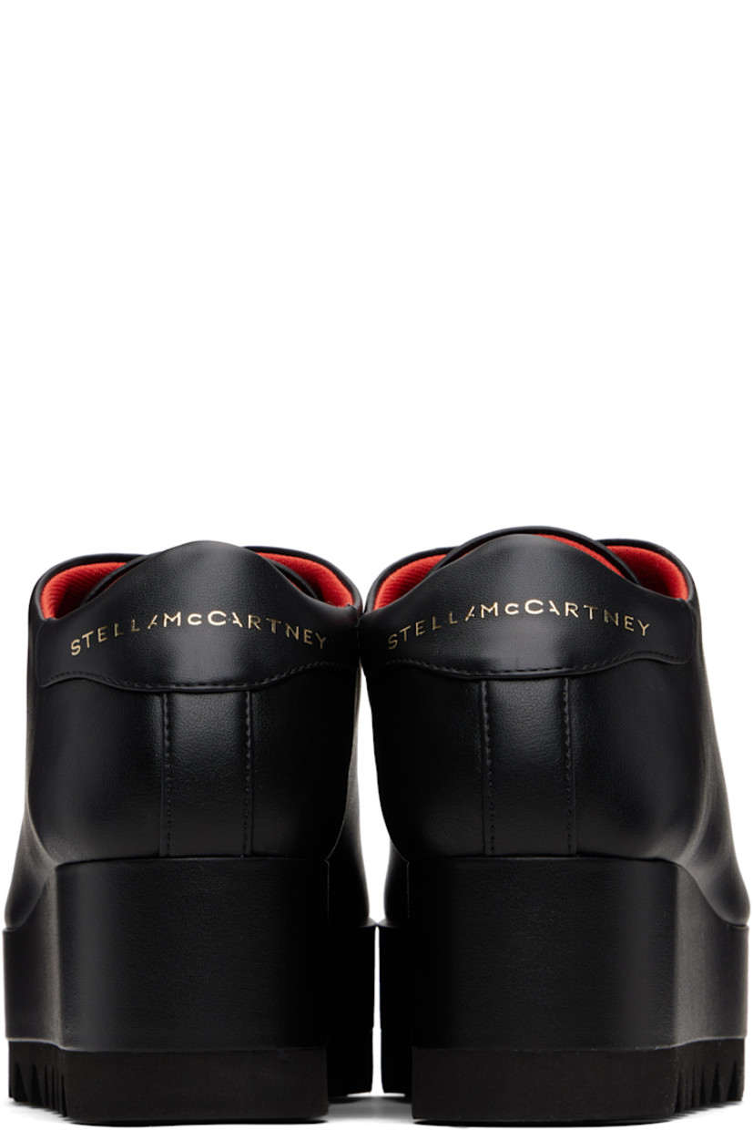 Low-top buffed faux-leather sneakers.

· Lace-up closure
· Logo patch at padded tongue
· Padded collar
· Logo stamp at heel tab
· Mesh lining
· Covered platform midsole
· Treaded foam rubber sole
· Platform: H1.5"
· Heel: H2.25"

Made from cruelty-free, non-animal materials.

Supplier color: Black