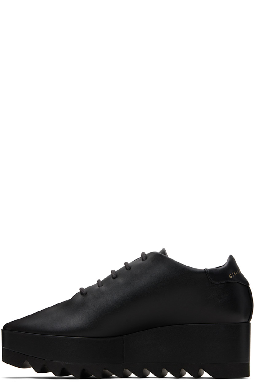 Low-top buffed faux-leather sneakers.

· Lace-up closure
· Logo patch at padded tongue
· Padded collar
· Logo stamp at heel tab
· Mesh lining
· Covered platform midsole
· Treaded foam rubber sole
· Platform: H1.5"
· Heel: H2.25"

Made from cruelty-free, non-animal materials.

Supplier color: Black