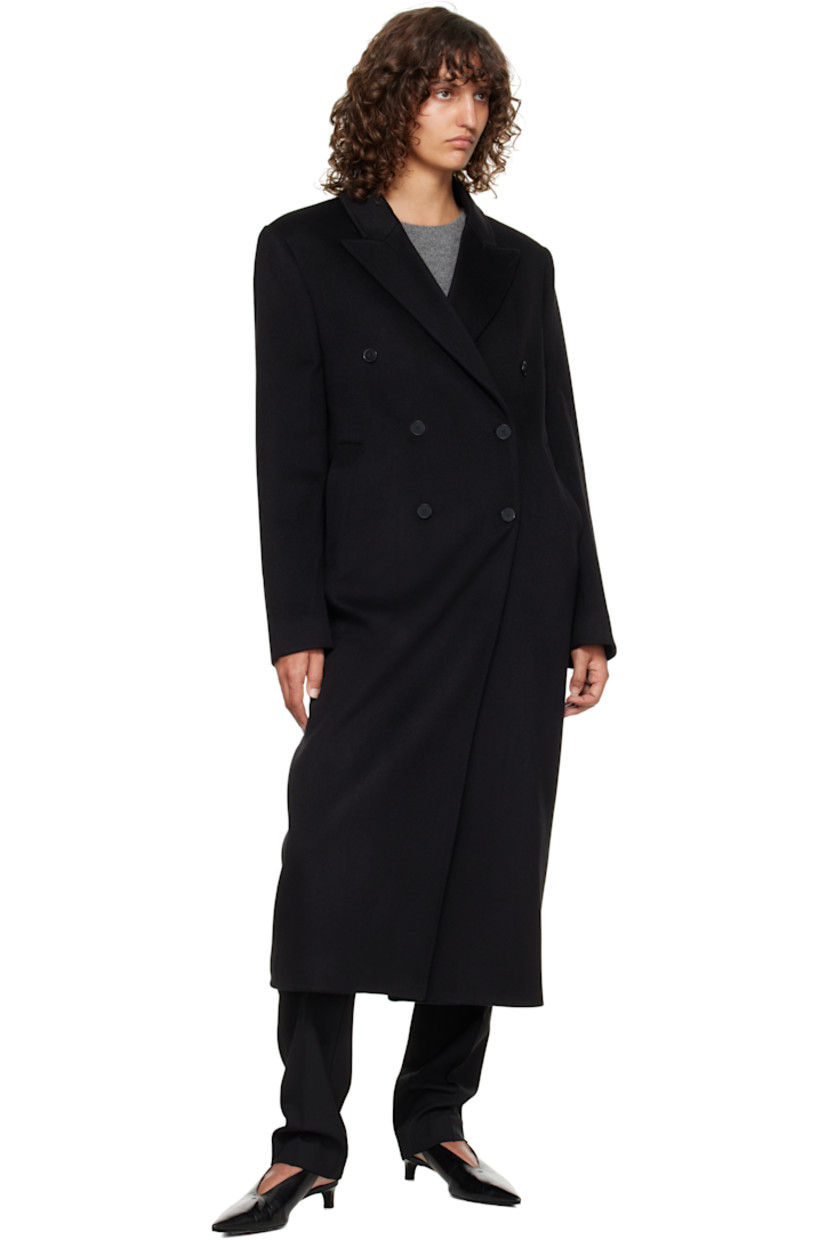 Wool- and cashmere-blend melton coat.

· OEKO-TEX® STANDARD 100-certified
· Peaked lapel
· Double-breasted button closure
· Welt pockets at waist
· Padded shoulders
· Surgeon's cuffs 
· Central vent at back hem
· Welt pocket at interior
· Full satin lining

Supplier color: Black