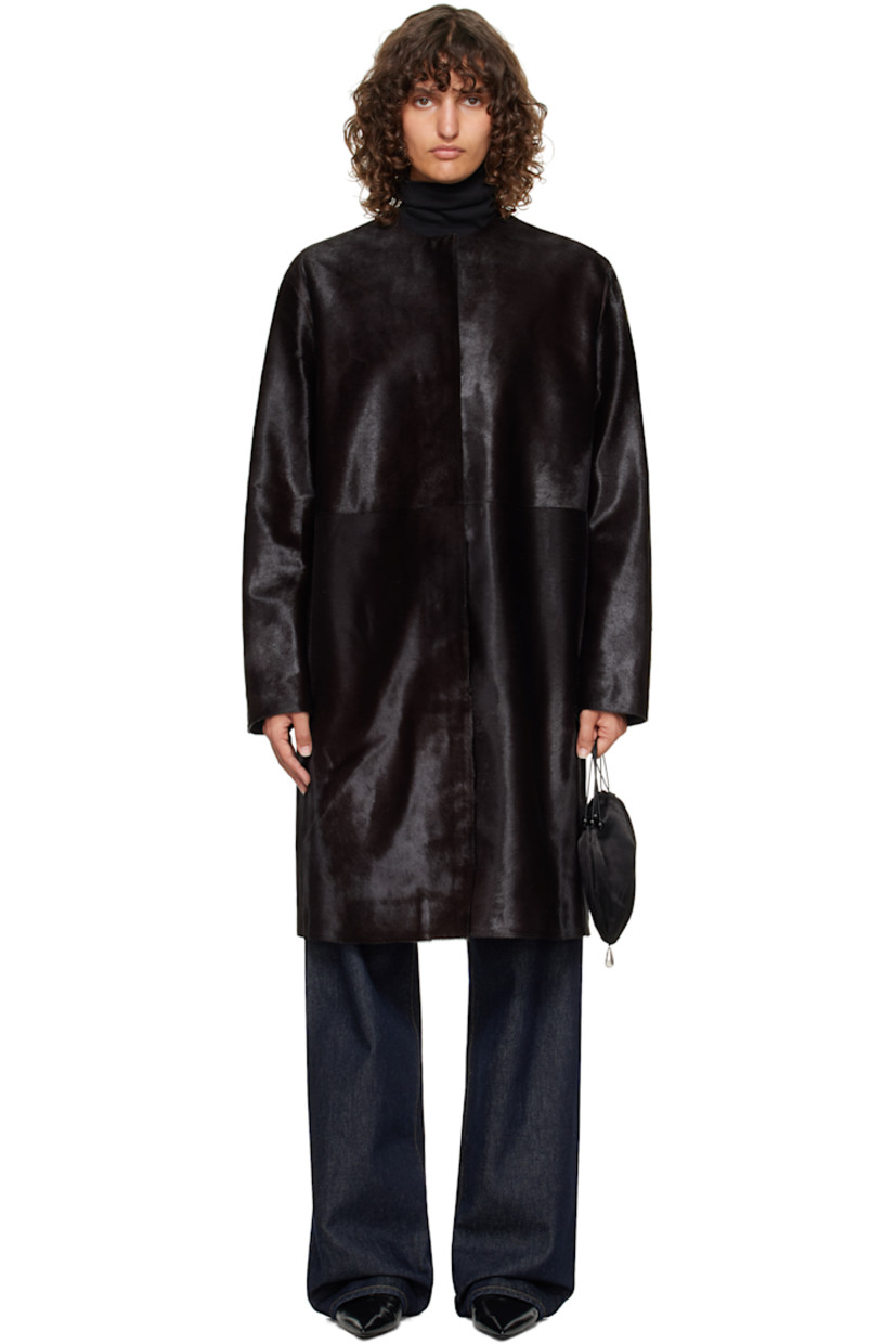 Calf-hair coat.

· Round neck
· Concealed button closure
· Seam pockets at waist
· Welt pocket at interior
· Full satin lining

Supplier color: Coffee