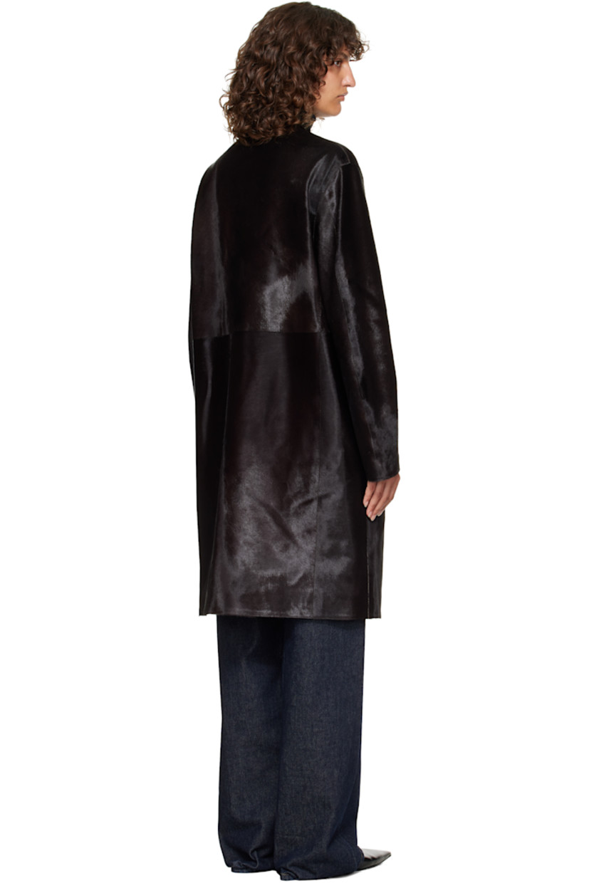 Calf-hair coat.

· Round neck
· Concealed button closure
· Seam pockets at waist
· Welt pocket at interior
· Full satin lining

Supplier color: Coffee