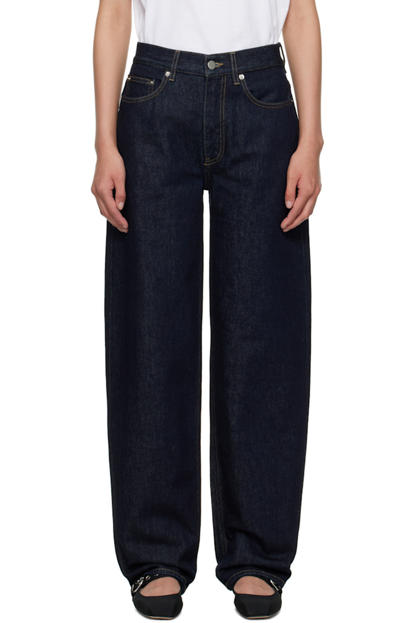 Non-stretch organic cotton denim jeans.

· Straight-leg
· Low-rise
· Belt loops
· Five-pocket styling
· Zip fly
· Logo patch at back waistband
· Silver-tone hardware
· Contrast stitching in tan

Supplier color: Raw wash