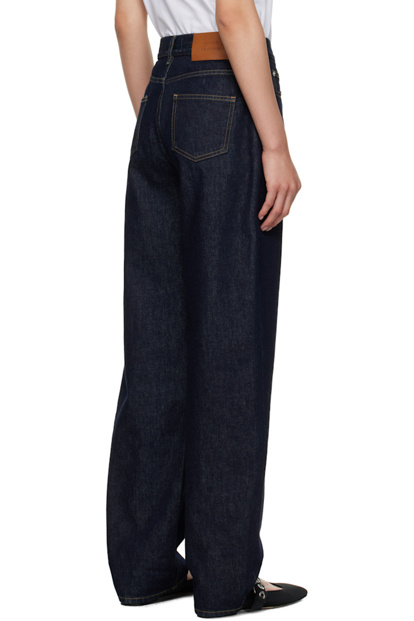 Non-stretch organic cotton denim jeans.

· Straight-leg
· Low-rise
· Belt loops
· Five-pocket styling
· Zip fly
· Logo patch at back waistband
· Silver-tone hardware
· Contrast stitching in tan

Supplier color: Raw wash