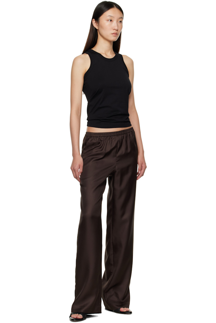 Silk twill trousers.

· OEKO-TEX® STANDARD 100-certified
· Loose-fit
· Mid-rise
· Elasticized waistband
· Three-pocket styling

Supplier color: Deep Brown