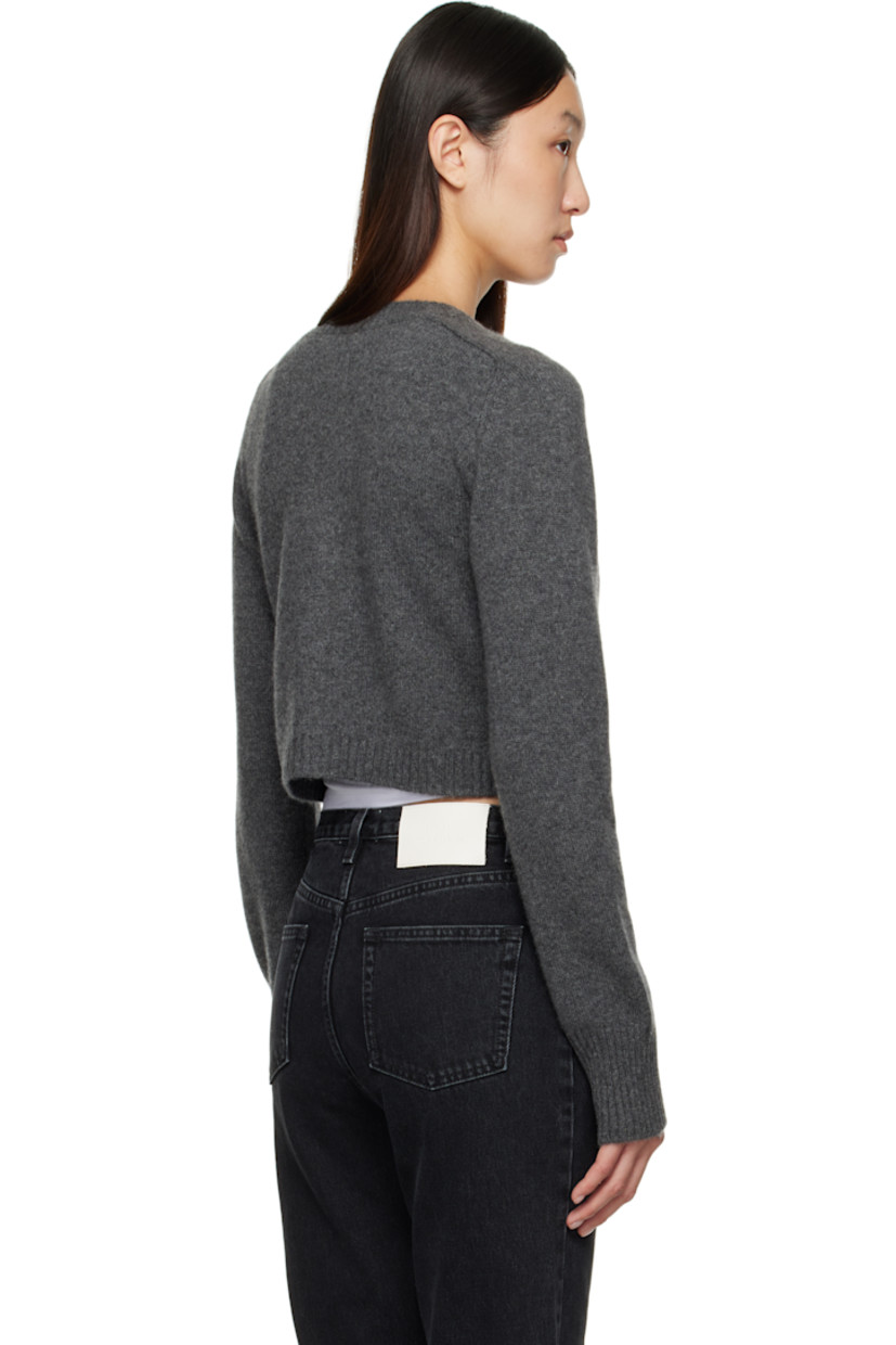 Knit cashmere cardigan.

· OEKO-TEX® STANDARD 100-certified
· Rib-knit crewneck, placket, hem, and cuffs
· Button closure
· Logo embroidered at front hem
· Cropped hem
· Saddle shoulders

Supplier color: Anthracite melange