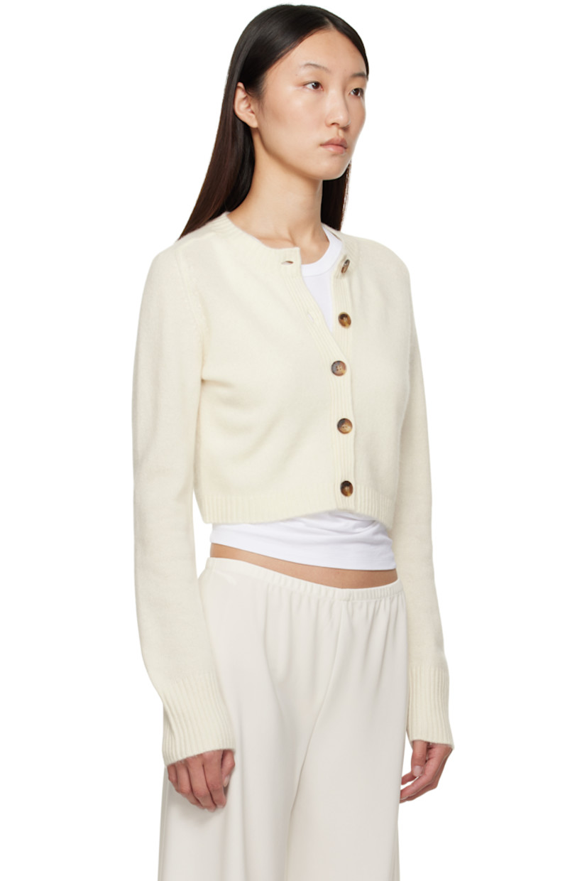 Knit cashmere cardigan.

· OEKO-TEX® STANDARD 100-certified
· Rib-knit crewneck, placket, hem, and cuffs
· Button closure
· Logo embroidered at front hem
· Cropped hem
· Saddle shoulders

Supplier color: Ivory