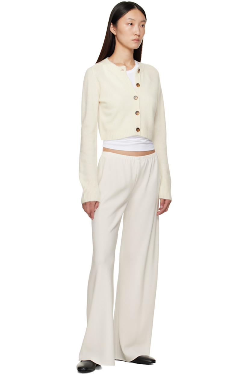 Knit cashmere cardigan.

· OEKO-TEX® STANDARD 100-certified
· Rib-knit crewneck, placket, hem, and cuffs
· Button closure
· Logo embroidered at front hem
· Cropped hem
· Saddle shoulders

Supplier color: Ivory