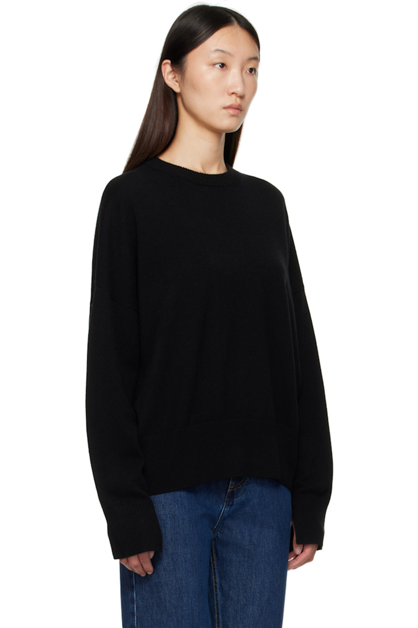 Knit cashmere sweater.

· OEKO-TEX® STANDARD 100-certified
· Rib-knit crewneck, hem, and cuffs
· Logo embroidered at front hem
· Dropped shoulders
· Vented cuffs

Supplier color: Black