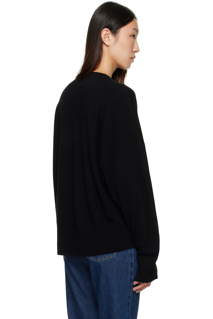 Knit cashmere sweater.

· OEKO-TEX® STANDARD 100-certified
· Rib-knit crewneck, hem, and cuffs
· Logo embroidered at front hem
· Dropped shoulders
· Vented cuffs

Supplier color: Black