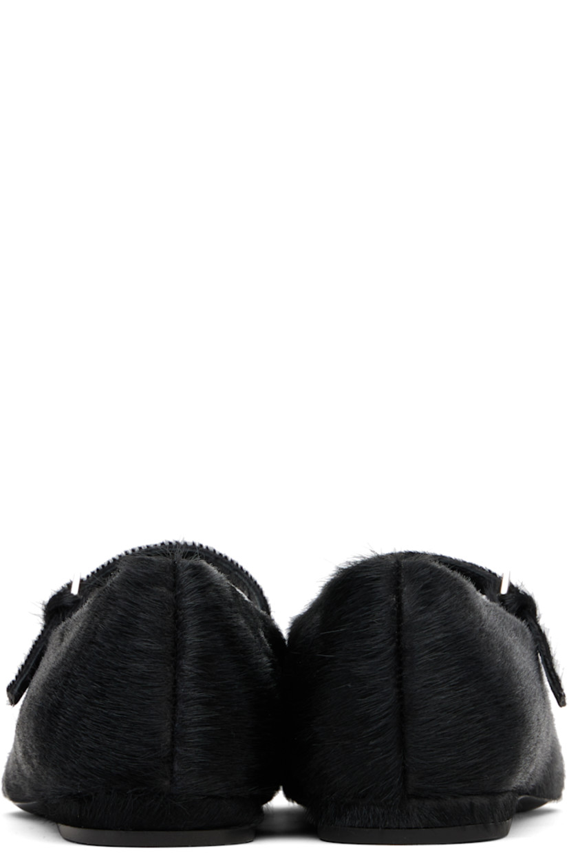 Calf-hair Mary-Jane-style flats.

· Pointed toe
· Pin-buckle strap at vamp
· Buffed leather lining
· Rubber heel
· Leather sole

Supplier color: Black