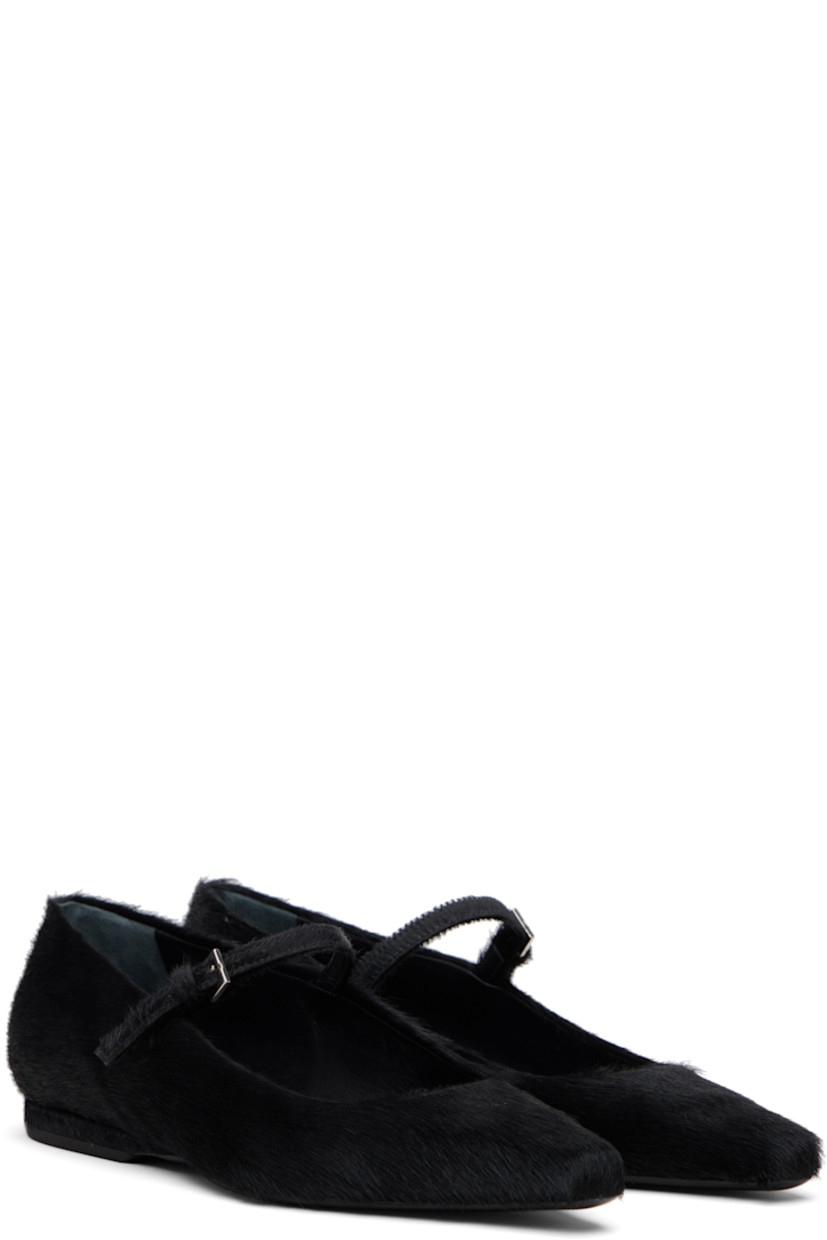 Calf-hair Mary-Jane-style flats.

· Pointed toe
· Pin-buckle strap at vamp
· Buffed leather lining
· Rubber heel
· Leather sole

Supplier color: Black