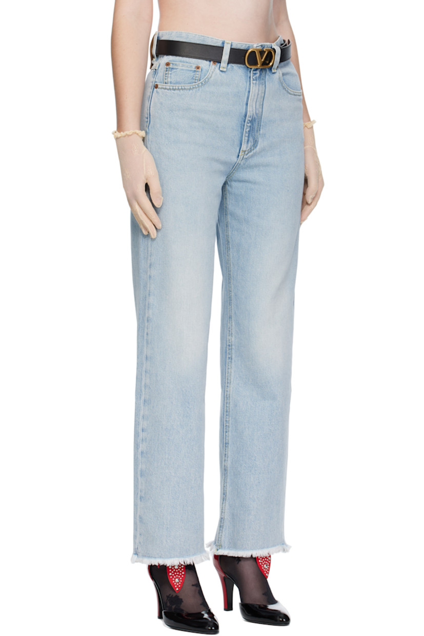 Non-stretch denim jeans.

· Fading throughout
· Belt loops
· Five-pocket styling
· Zip fly
· Frayed edge at cuffs
· Leather logo patch at back waistband
· Logo-engraved bronze-tone hardware
· Contrast stitching in yellow

Supplier color: Denim blue