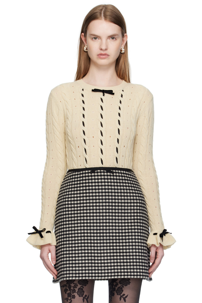Cable-knit virgin wool sweater. 

· Perforations throughout
· Rib-knit crewneck, hem, and cuffs
· Bow accent and lace-up detailing at collar and cuffs
· Grosgrain trim woven at front

Supplier color: Betulla