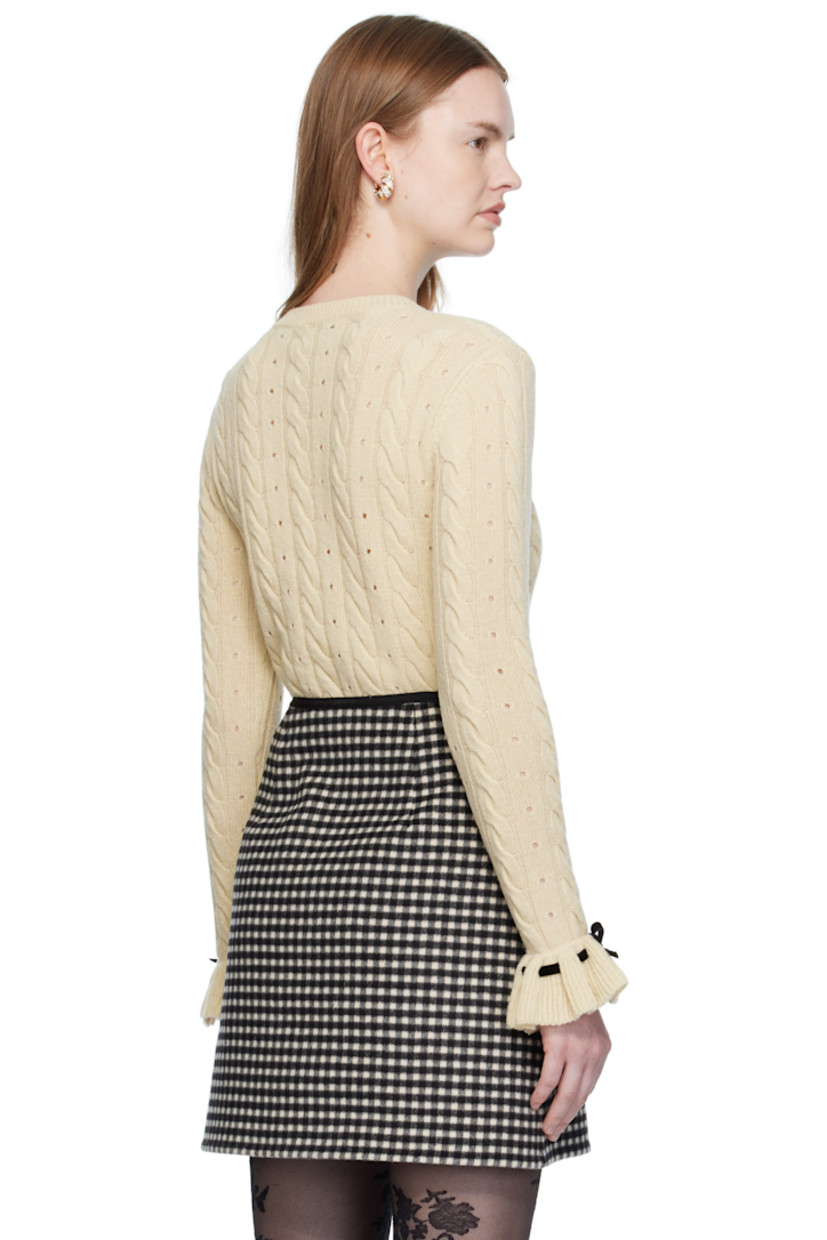 Cable-knit virgin wool sweater. 

· Perforations throughout
· Rib-knit crewneck, hem, and cuffs
· Bow accent and lace-up detailing at collar and cuffs
· Grosgrain trim woven at front

Supplier color: Betulla