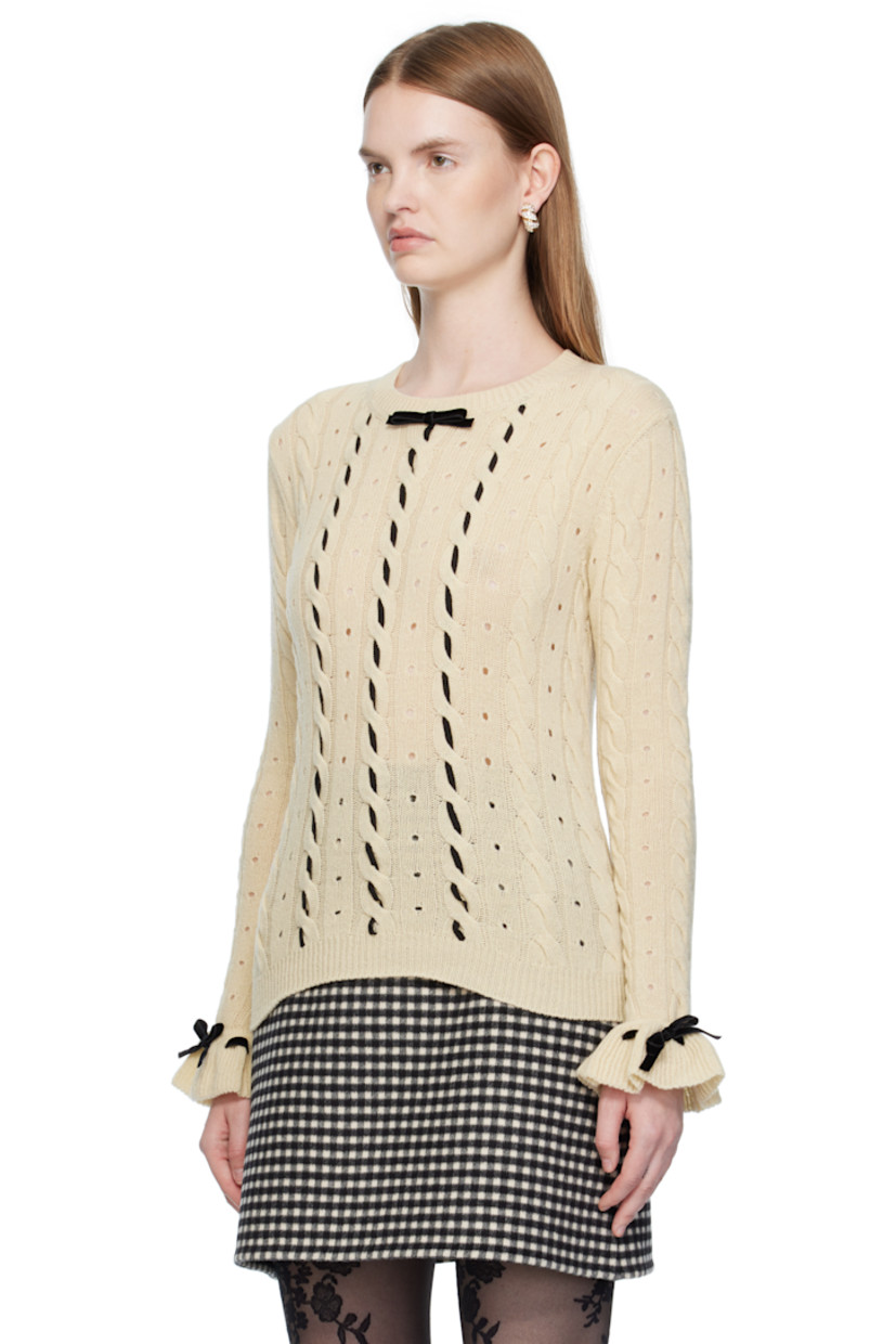 Cable-knit virgin wool sweater. 

· Perforations throughout
· Rib-knit crewneck, hem, and cuffs
· Bow accent and lace-up detailing at collar and cuffs
· Grosgrain trim woven at front

Supplier color: Betulla