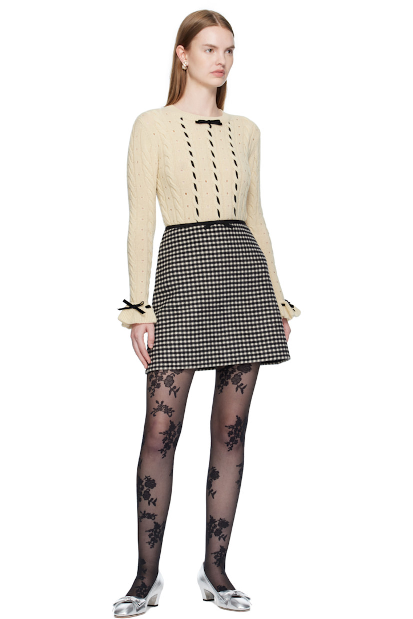Cable-knit virgin wool sweater. 

· Perforations throughout
· Rib-knit crewneck, hem, and cuffs
· Bow accent and lace-up detailing at collar and cuffs
· Grosgrain trim woven at front

Supplier color: Betulla