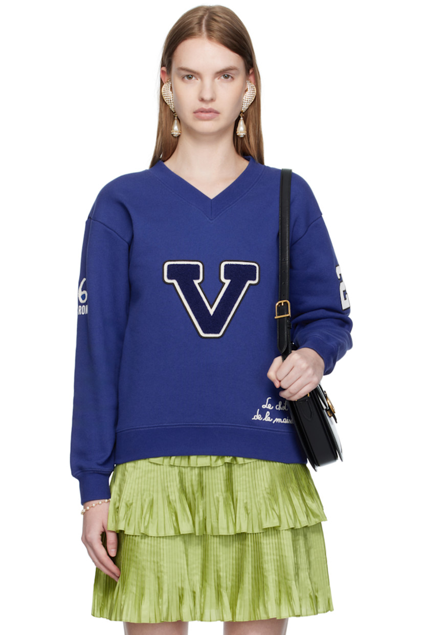 French terry sweatshirt. 

· Text embroidered and printed throughout
· Rib-knit V-neck, hem, and cuffs
· Bouclé logo appliqué at chest
· Dropped shoulders
· Text appliqué at sleeve
· Embroidered graphic appliqué at back

Supplier color: Blue/Ivory