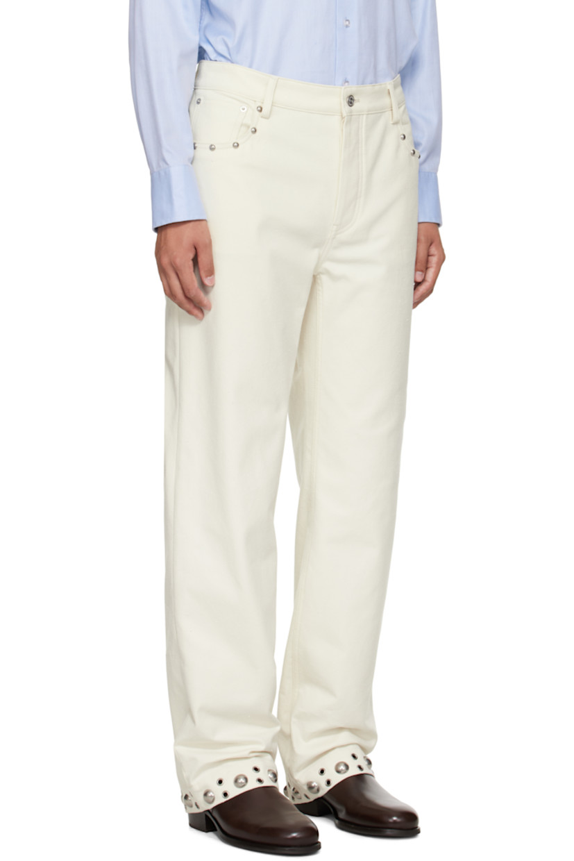 Pilled non-stretch denim trousers.

· Belt loops
· Five-pocket styling
· Button fly 
· Studs at front and cuffs
· Calfskin logo patch at back waistband 
· Silver-tone hardware

Supplier color: Latte