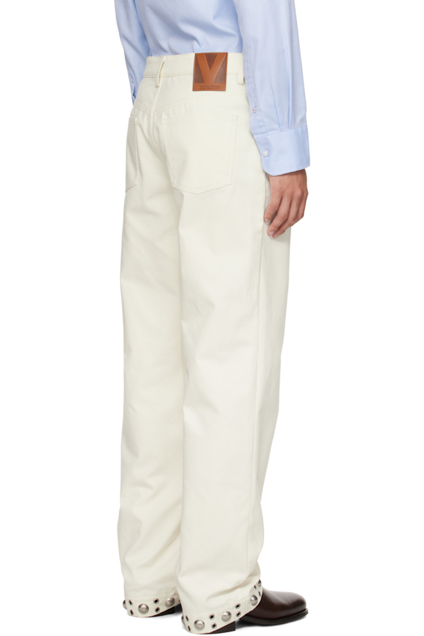Pilled non-stretch denim trousers.

· Belt loops
· Five-pocket styling
· Button fly 
· Studs at front and cuffs
· Calfskin logo patch at back waistband 
· Silver-tone hardware

Supplier color: Latte